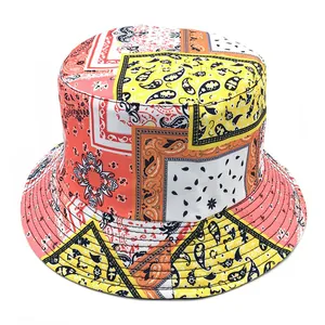 Double-sided paisley print cotton bucket hat for sun protection in vibrant orange and yellow