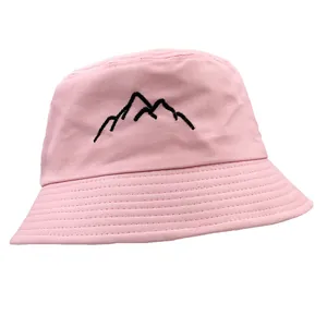 Pink cotton bucket hat with black mountain embroidery in a minimalist outdoor style