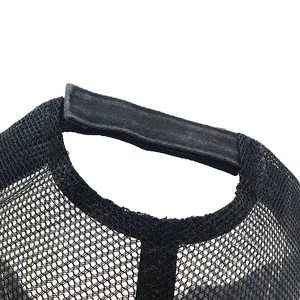 Black mesh trucker hat with adjustable strap and washed denim detail on the back view