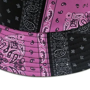 Double-sided paisley print bucket hat in black and pink with durable canvas material