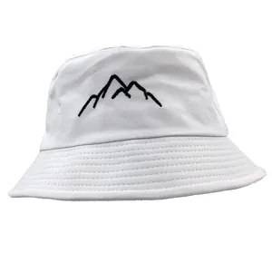 Detail view of mountain embroidery on white cotton bucket hat with reinforced brim sewing