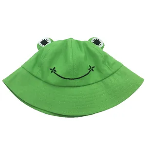 Bright green frog bucket hat with big eyes and embroidered smile for kids and adults