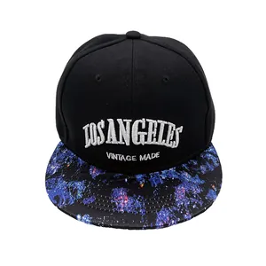 Close-up of white Los Angeles 3D embroidery on a black snapback cap with starry brim