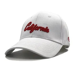 Detailed view of red California 3D embroidery on a white cotton baseball cap