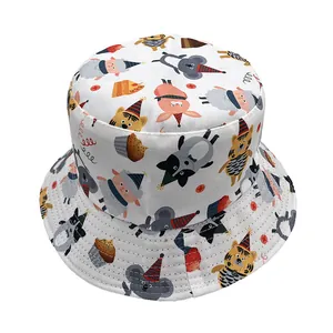 Detail of white bucket hat featuring colorful cartoon animals and sweet dessert patterns