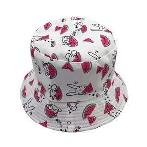 Detail of white cotton sun hat with cute cartoon watermelon and rabbit prints