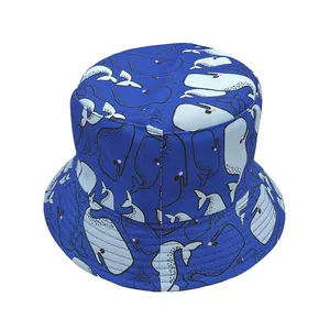 Reversible bucket hat with navy blue dolphin and whale prints for sun protection