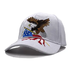 Detailed embroidery of American bald eagle and flag motifs on a white cotton baseball cap