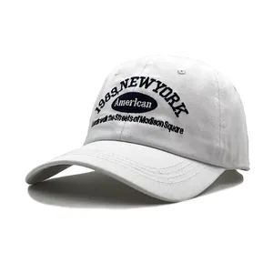 White cotton baseball cap with 1989 New York American embroidery and curved brim