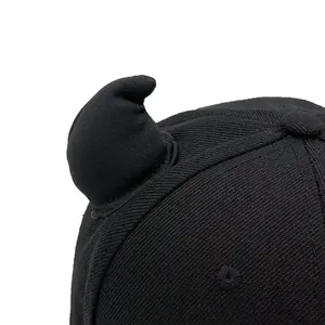 Black baseball cap featuring devil horn decorations and premium twill fabric texture
