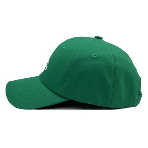 Emerald green cotton twill baseball cap with white side embroidery and metal eyelets