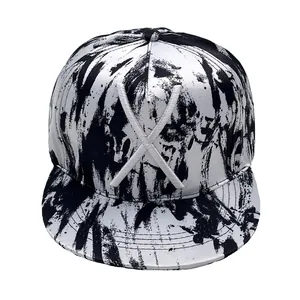 Graffiti print snapback baseball cap with white 3D X embroidery and flat brim design