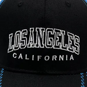 Black Los Angeles baseball cap with white embroidery and blue contrast zigzag stitching