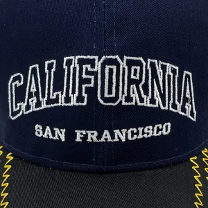 Navy blue California baseball cap with white embroidery and yellow zigzag brim stitching