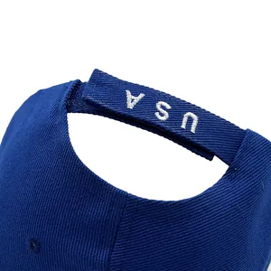 Navy blue baseball cap featuring embroidered USA velcro strap on durable cotton twill