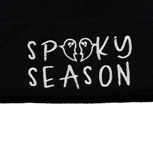 Black Spooky Season beanie featuring white ghost embroidery for Halloween and winter warmth