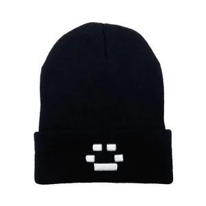 Black Quackity knit beanie featuring white pixel face embroidery and cuffed design