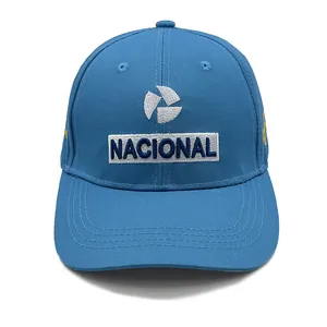 Detailed embroidery of NACIONAL logo and signature on blue cotton racing baseball cap