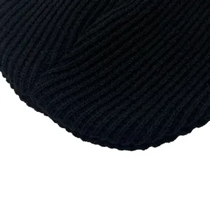Detailed close-up showing the premium black ribbed knit texture and elastic weave on this beanie