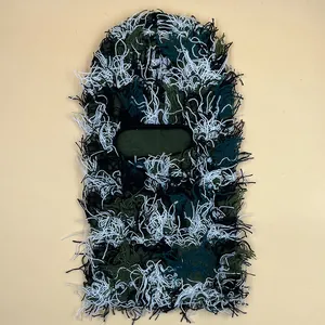 Detail view of camouflage balaclava with shaggy fringe texture and reinforced eye opening