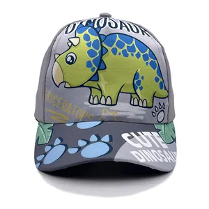 Kids grey baseball cap featuring a green triceratops cartoon print and wide blue brim