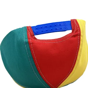 Close-up of the adjustable blue snapback closure on a colorful rainbow propeller hat
