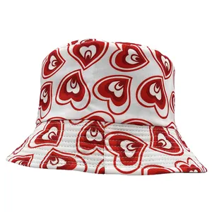 Summer bucket hat with all-over red heart pattern and wide brim for sun protection