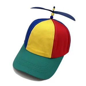 Rainbow patchwork baseball cap with a spinning blue propeller top for kids and adults