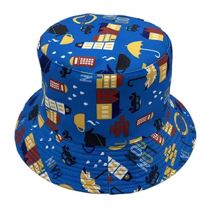 Detail of blue bucket hat featuring London themes like double-decker buses and umbrellas
