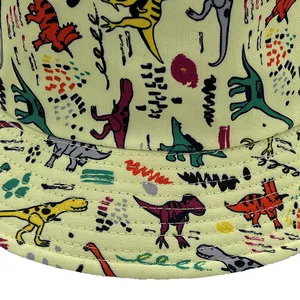 Macro shot of cotton fisherman hat featuring colorful dinosaur patterns and neat stitching