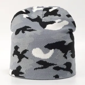 Detail of grey and black camouflage knitted beanie showing the fine texture and fabric