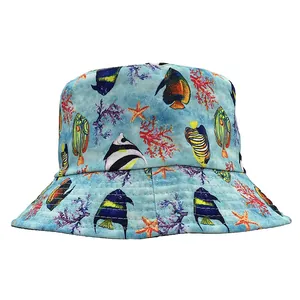 Detail of blue bucket hat featuring colorful tropical fish and vibrant coral patterns