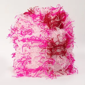 Close-up of fuzzy gradient knit texture in pink and purple shades with soft feather yarn