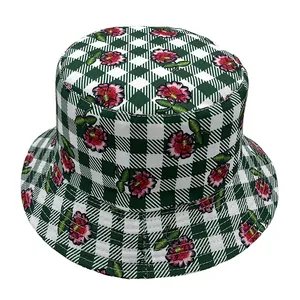 Detail of floral embroidery on a green checkerboard pattern bucket hat for summer