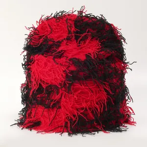 Red and black distressed knit beanie with long fringe yarn in punk streetwear style