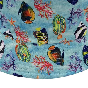 Close-up of tropical fish and coral pattern on blue summer bucket hat brim
