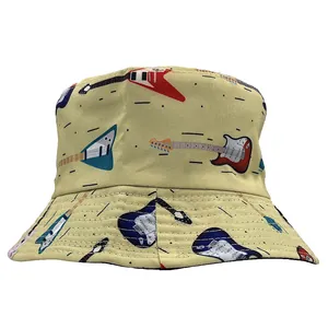 Detail of a beige bucket hat with all-over electric guitar print and visible stitching