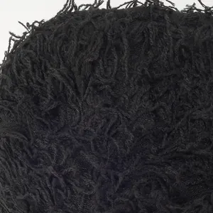 Close-up of black camouflage knit beanie showing premium plush texture and curly fibers