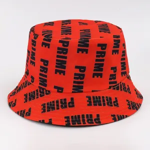 Close-up of red cotton bucket hat with black vertical PRIME letter print and twill texture