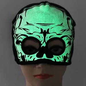 Black knitted beanie with glowing green alien skull design and eye holes for Halloween