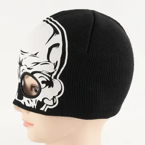 Black knitted skull balaclava with white glow-in-the-dark alien print for Halloween decor
