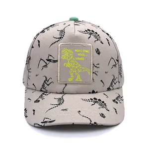 Kids dinosaur bone print baseball cap in grey with cartoon patch and green top button