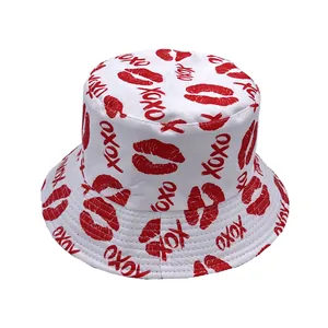 Detailed stitching on white bucket hat with red lip prints and XOXO pattern