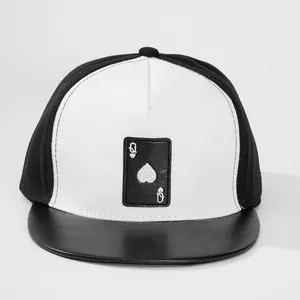 Detail of a black faux leather brim and white crown featuring a Queen of Spades patch