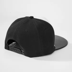 Minimalist black and white snapback hat with adjustable closure and flat brim design