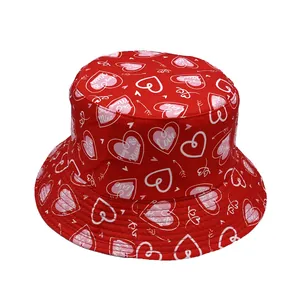 Detail of red bucket hat with heart prints and Love letters for Valentine's Day