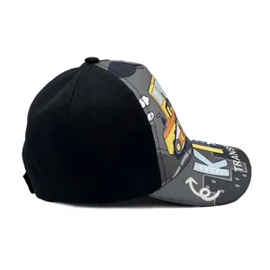 Side view detail of a kids baseball cap with cartoon school bus print and graffiti brim