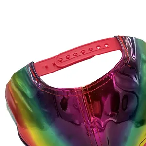 Rainbow holographic snapback hat featuring a shiny metallic finish and adjustable red strap
