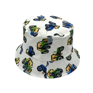 Close-up detail of cartoon tractor prints on white cotton sun hat with reinforced stitching