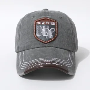 Vintage gray washed cotton baseball cap with New York shield embroidery and leather brim trim
